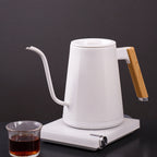zeroHero Entry-lux electric gooseneck kettle in black on its base, side view