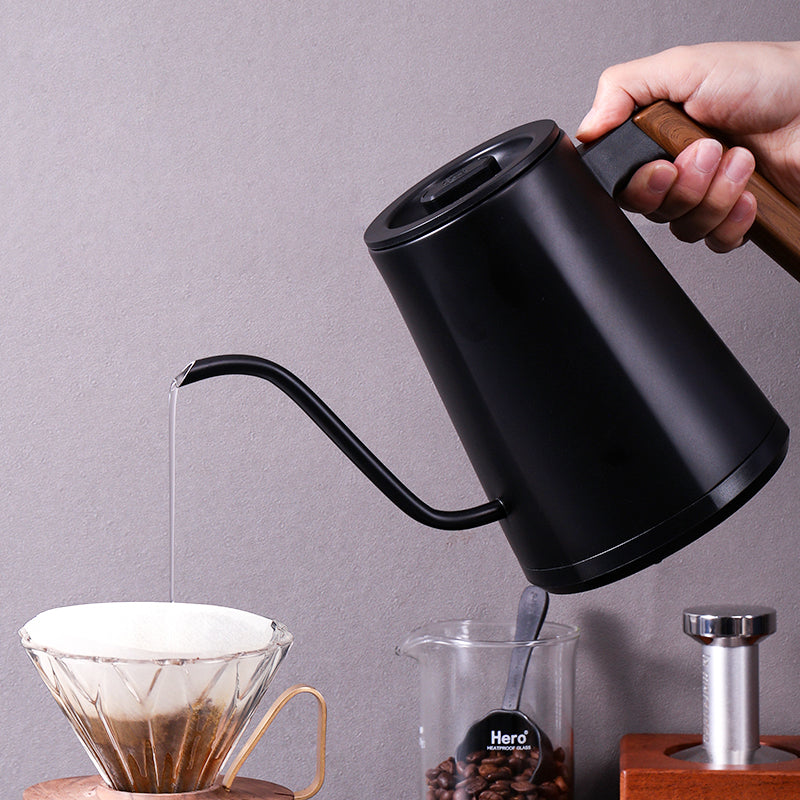zeroHero Entry-lux electric gooseneck kettle in black on its base, side view