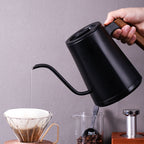 zeroHero Entry-lux electric gooseneck kettle in black on its base, side view