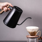 zeroHero Entry-lux electric gooseneck kettle in black on its base, side view