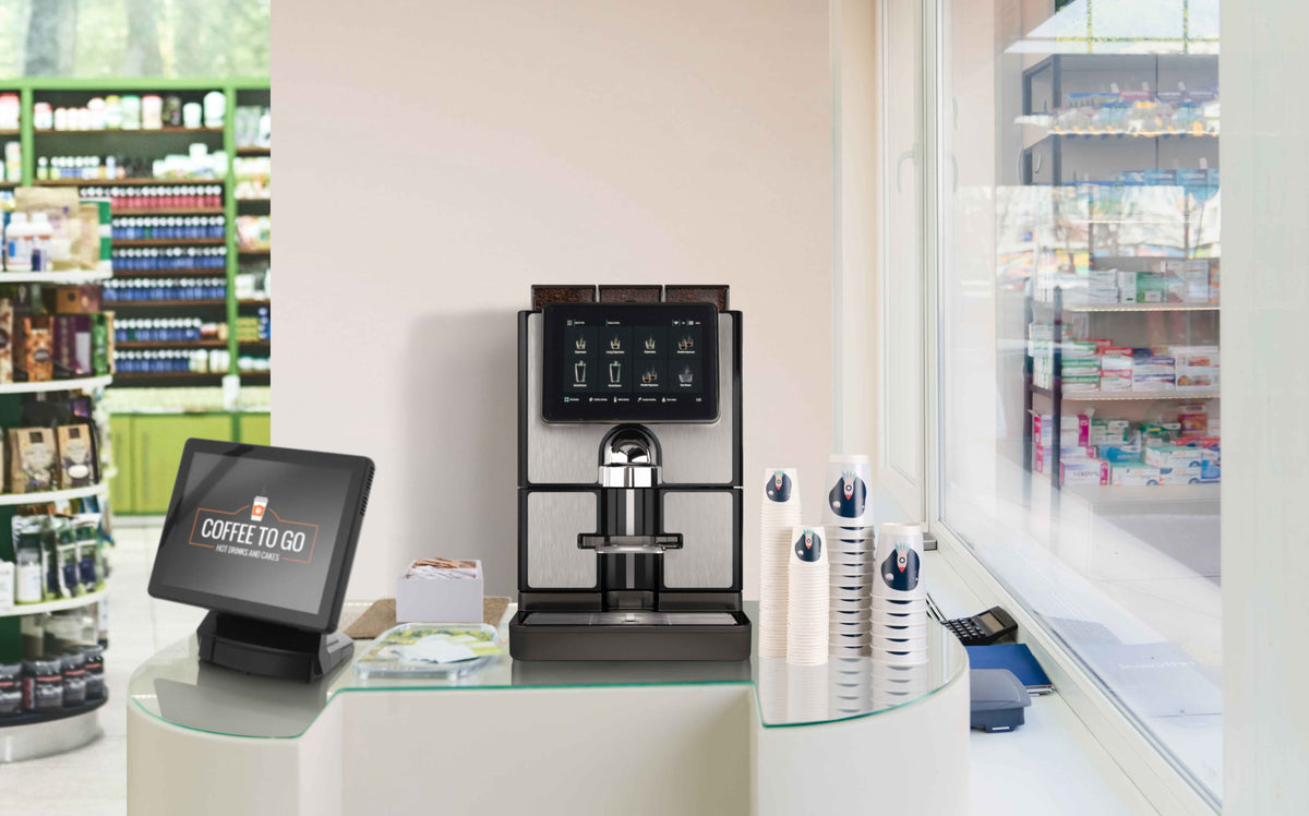 Carimali SilverTwin Plus fully automatic coffee machine in silver and black, front view