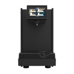 Heylo Milky induction milk unit in black with steel milk jug, angled view